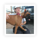 Toni Faragalli, co-founder of Dog Gone Tired Sanctuary and Rescue, and her boxer, Mister. 